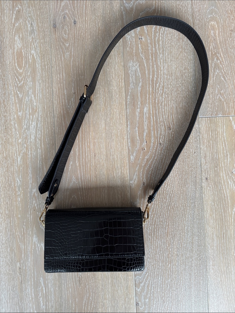 ASOS DESIGN elongated cross-body bag with detachable strap in black croc.
